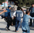 Image: Afghan policemen carry a wounded man at the site of a blast in Kabul - ИА Общественная служба новостей