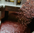 Artisan chocolate making, adding cocoa grits in the Melanger Stone Grinder - ИА Общественная служба новостей