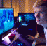Teenage Boy Wearing Headset Gaming At Home Using Dual Computer Screens - ИА Общественная служба новостей