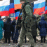 A serviceman walks while guarding an area during grounds of the park ceremony in the separatist-held settlement of Makiivka (Makeyevka) outside Donetsk - ИА Общественная служба новостей