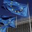 European Union flags flutter outside the European Commission headquarters in Brussels - ИА Общественная служба новостей