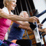 Happy senior people doing indoor biking in a fitness club - ИА Общественная служба новостей
