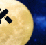 Satellite silhouette over a full moon - ИА Общественная служба новостей