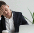Frustrated millennial businessman having strong headache tired f - ИА Общественная служба новостей