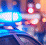 Danger on the street. Blue flasher on the police car at night. - ИА Общественная служба новостей