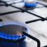 Gas kitchen stove cook with blue flames burning. Panel from steel with a gas - ИА Общественная служба новостей